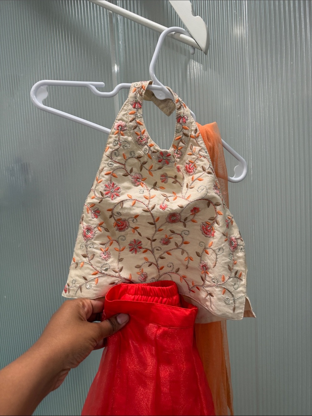 Embroidered Cream Halter Top with Orange Accents. Lehenga set for kids